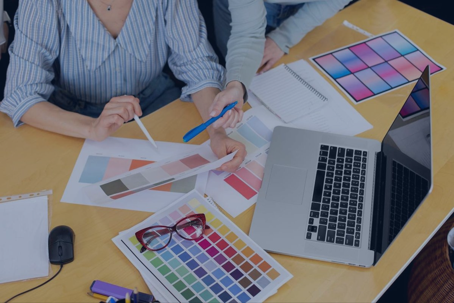 Designers discussing colours from a palette
